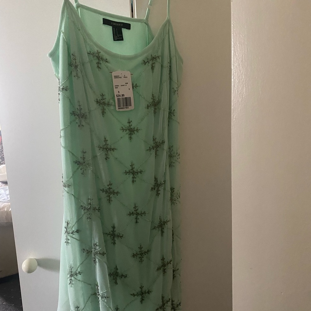 Size Small mint green with sequin appliqués, spaghetti straps, brand new